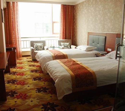 Jiuquan Zhenhao 6+1 Business Hotel