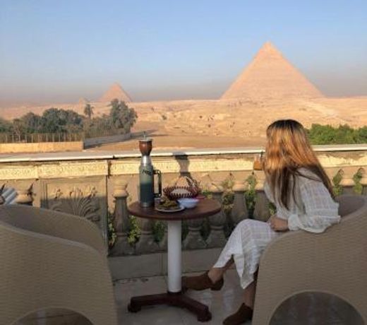 Sphinx palace pyramids view