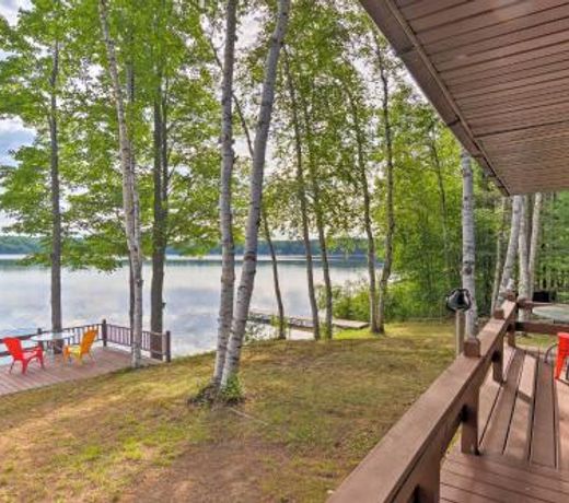 Lakefront Manistique Cabin with Private Dock and Fire Pit