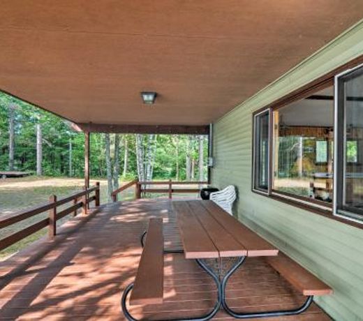 Lakefront Manistique Cabin with Private Dock and Fire Pit