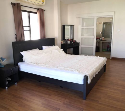 Clean and cozy bedroom with big bathroom.