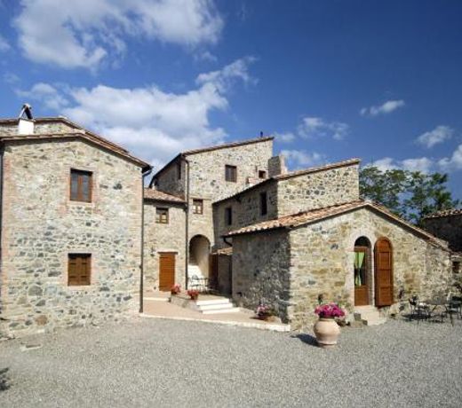In a wonderful medieval village on the Tuscan hills, with air conditioning