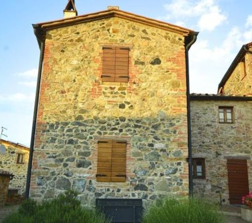 In a wonderful medieval village on the Tuscan hills, with air conditioning