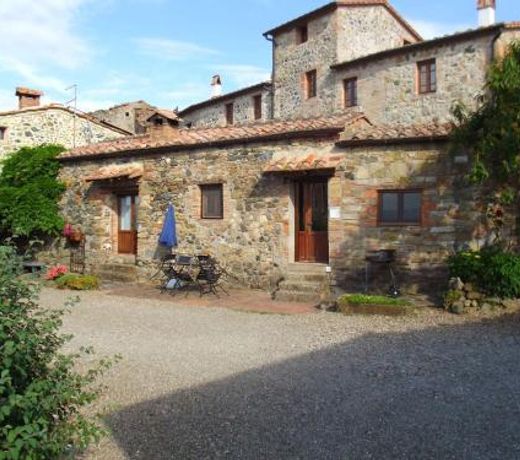 In a wonderful medieval village on the Tuscan hills, with air conditioning