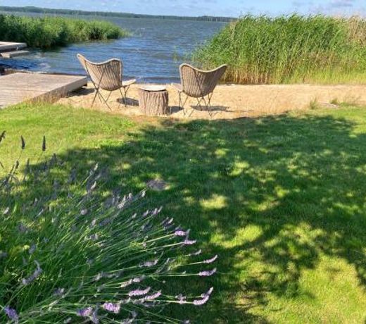 Wellness-Apartment mit Wasserblick, Pool, Sauna & Fitnessbereich