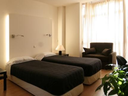 Hotel Asador H.M. Versus