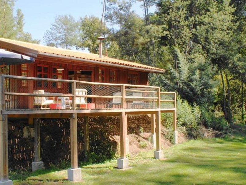 Detached house with a large porch, playground and pool