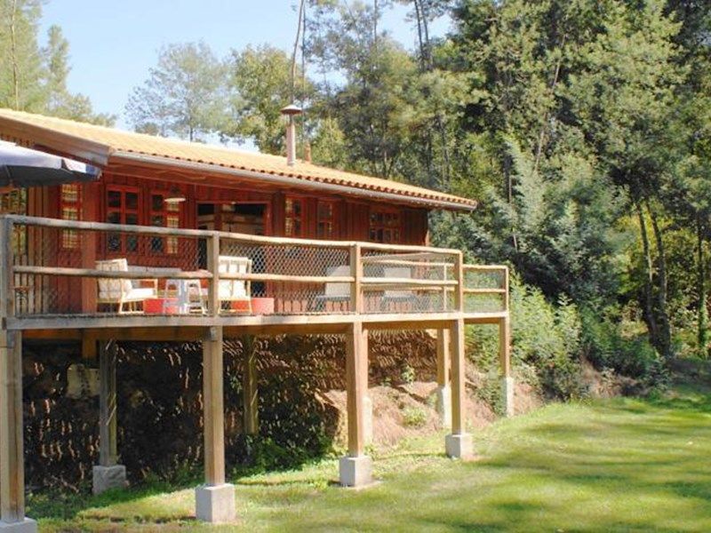 Detached house with a large porch, playground and pool