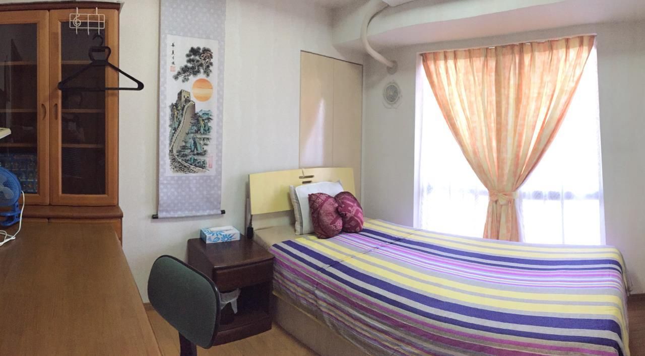 Single bed room with shared bathroom