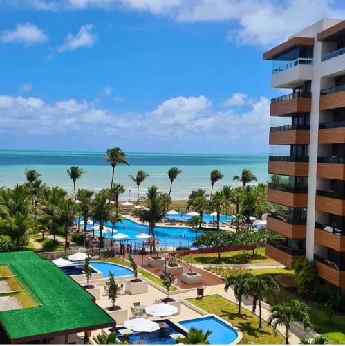 Apartamento a beira mar com piscina estilo resort