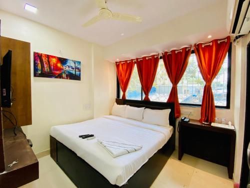 Deluxe Inn - Stay Near Kokilaben Dhirubhai Ambani Hospital