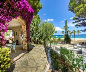 Villa with botanic garden in front of the beach Miami Platja Spain