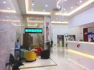 Фото отеля Shell Zhangjiagang City Jingang Town RT-Mart Central Shopping Plaza Ho