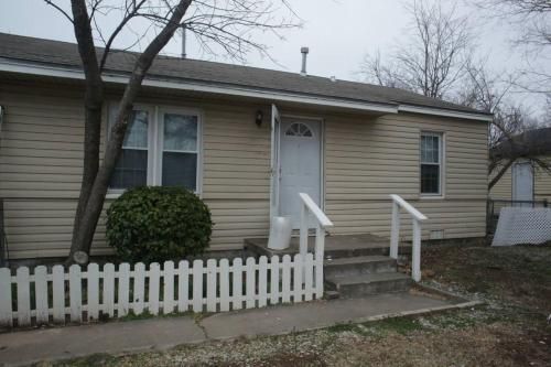 Photo of 1 bedroom with a fireplace close to base