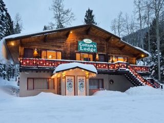 Фото отеля Cottam's Lodge by Alpine Village Suites