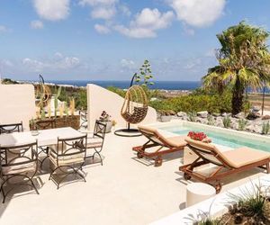 Pink Freud Luxury Villas, jetted pool, sea & sunset view Santorini Island Greece