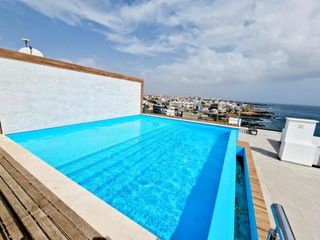 Фото отеля Apartamento encantador com piscina e vista mar