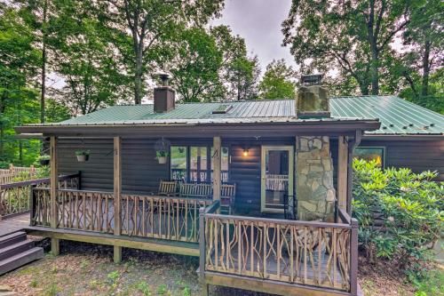 Photo of Quaint Cabin with Outdoor Fireplace and Sunroom!