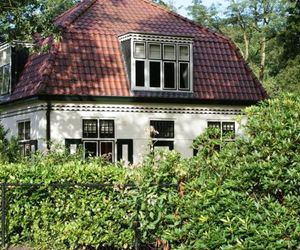 Characteristic house with a garden, surrounded by forest De Bult Netherlands